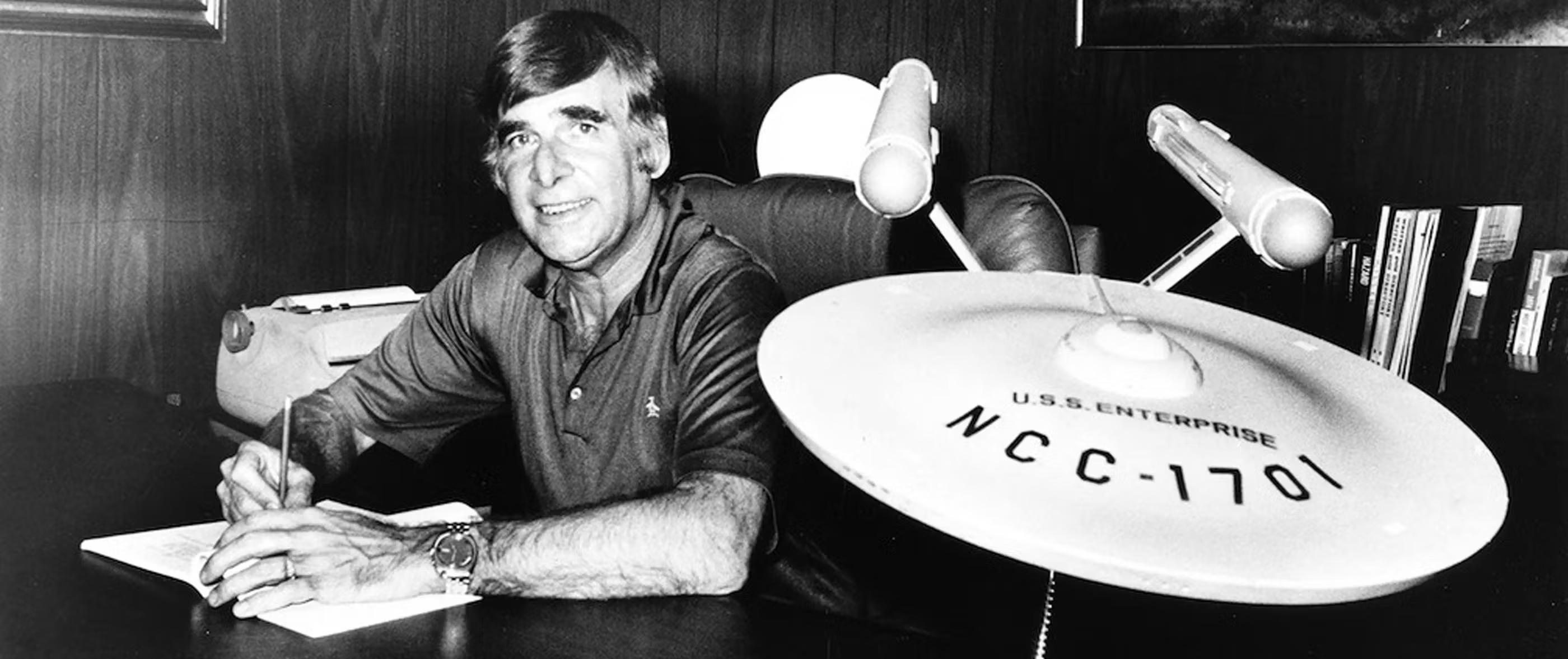 Gene Roddenberry beside a model of Enterprise NCC 1701 ship